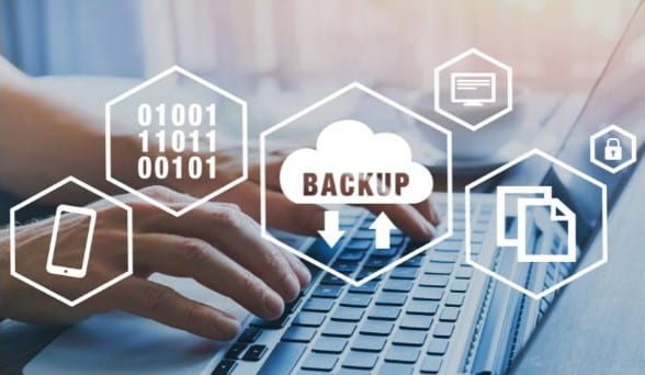 Cloud data backup and security technology displayed over a laptop.